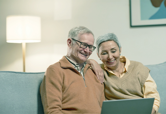 image of a man and his wife on a laptop